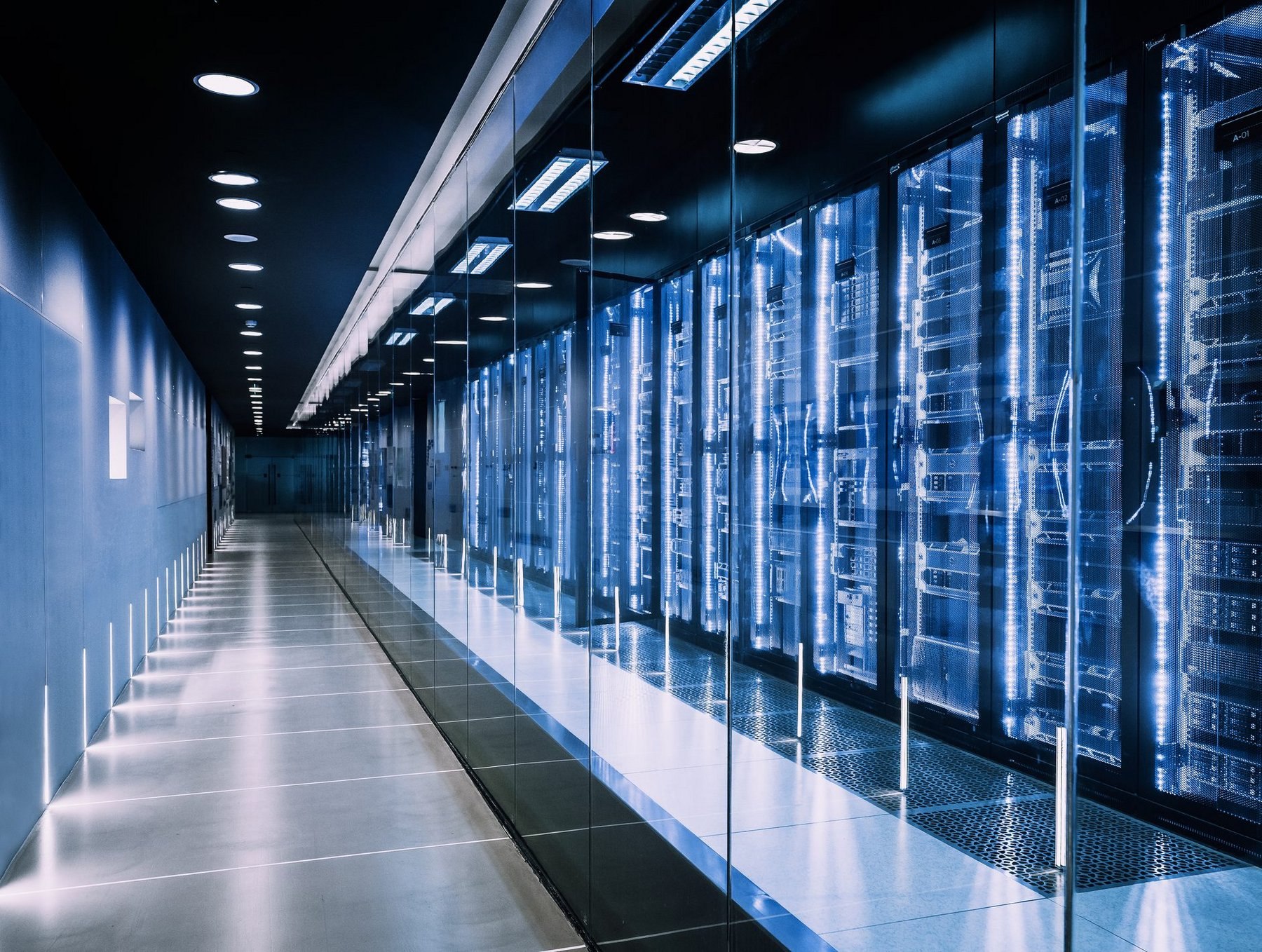 Modern secure datacenter corridor with illuminated server racks