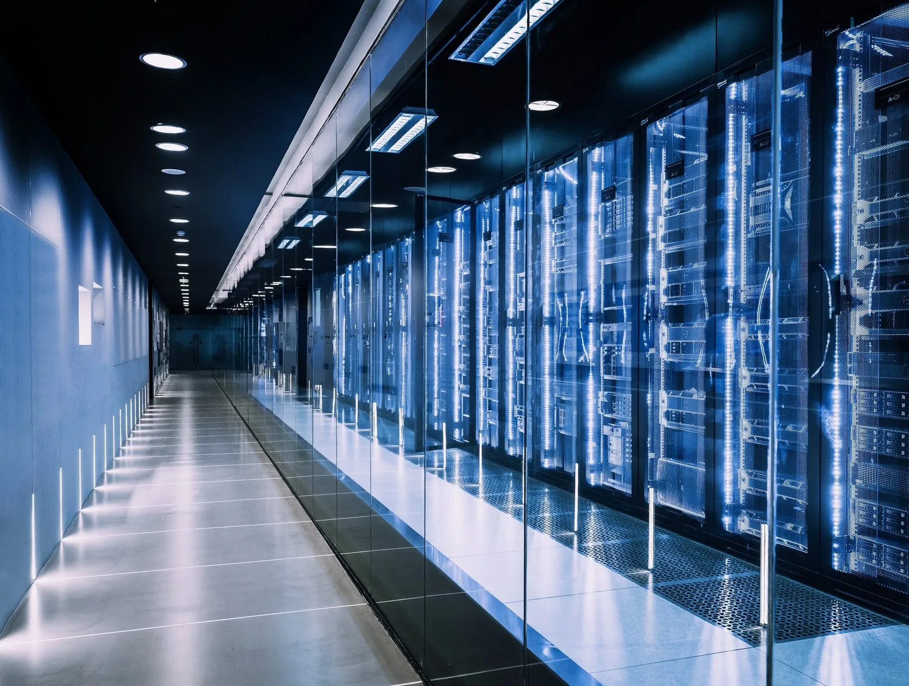 Modern secure datacenter corridor with illuminated server racks